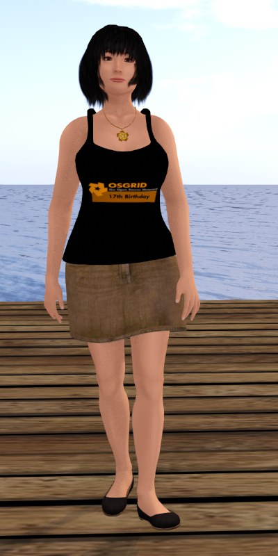 Digital rendering from OSgrid, one of the biggest out of thousands of 3-D virtual worlds based on OpenSimulator. It shows Juno Rowland, a female avatar, standing at the end of a wooden pier with the ocean in the background. The avatar is designed to resemble a woman who is no older than in her 30s. She is slim underneath loose-fitting clothes. She has light to medium-light skin, brown eyes and black hair which is styled as a neck-long bob. She is wearing a black tank top with the logo of the 17th birthday of OSgrid on it, a straight, lower-thigh-length, light-to-medium-light-brown denim miniskirt, a pair of black flat ballet shoes and a golden necklace with the OSgrid logo. The OSgrid logo is made up from five identical parallelograms arranged in a circular, star-like pattern. It is also part of the birthday logo which is mostly two tones of yellowish orange. The writing on the birthday logo reads, from top to bottom, “OSgrid”, “The Open Source Metaverse” and “17th Birthday”. A more detailed description of the image, including explanations, can be found in the post itself. If you are on Mastodon, Misskey or one of their forks, you can find it by opening the summary and content warning which includes, “CW: long (22,270 characters, including 20,377 characters of image descriptions), eye contact”, and then following the actual post text. If you are on Pleroma, Akkoma, another Pleroma fork, Friendica, Hubzilla or (streams), the full description will follow right after the images.